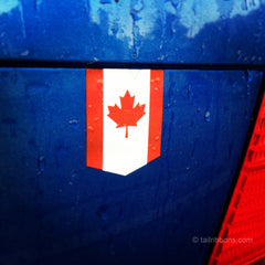 Flag of Canada car sticker on a VW Jetta in the rain